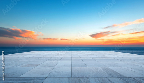 marble floor with a blue sky and sunset over the sea in the background
