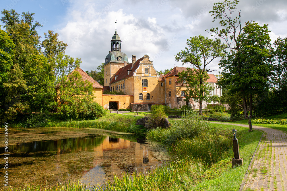 Fototapeta premium Historical Straupe palace on a sunny day in August in Straupe in Latvia