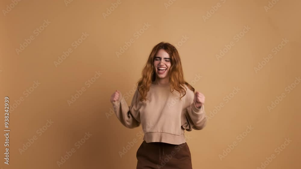 Smiling young woman jumping and waving hands Smiling young woman jumping and waving hands