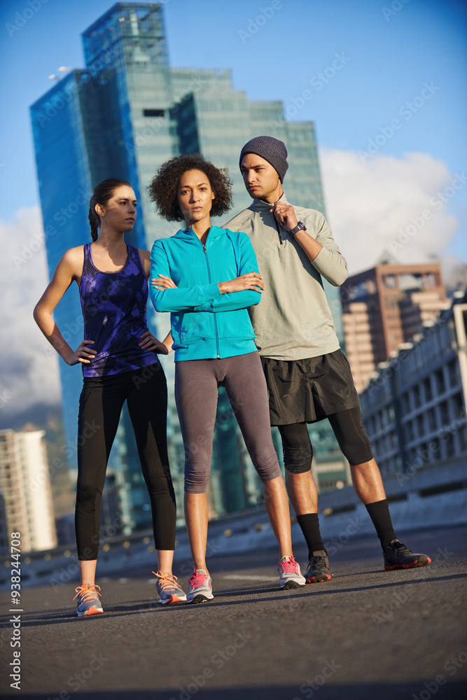 Obraz premium Sports, portrait and group of athletes in city for running with race, marathon or endurance training. Fitness, serious and team of people in town street for cardio workout, exercise or challenge.