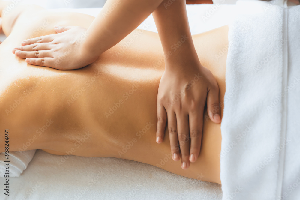 Closeup woman customer enjoying relaxing anti-stress spa massage and pampering with beauty skin recreation leisure in day light ambient salon spa at luxury resort or hotel. Quiescent Closeup woman customer enjoying relaxing anti-stress spa massage and pampering with beauty skin recreation leisure in day light ambient salon spa at luxury resort or hotel. Quiescent