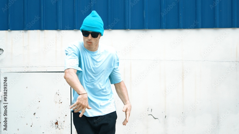 Motion shots of youthful hipster moving in lively groove at street. Caucasian break dance choreographer dancing in hip hop style. Energetic dancer perform b-boy dance. Outdoor sport 2024. Hiphop. Motion shots of youthful hipster moving in lively groove at street. Caucasian break dance choreographer dancing in hip hop style. Energetic dancer perform b-boy dance. Outdoor sport 2024. Hiphop.
