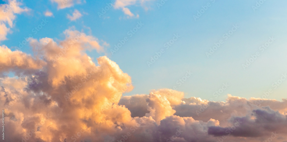 Blue sky with evening whimsical clouds during sunset Blue sky with evening whimsical clouds during sunset
