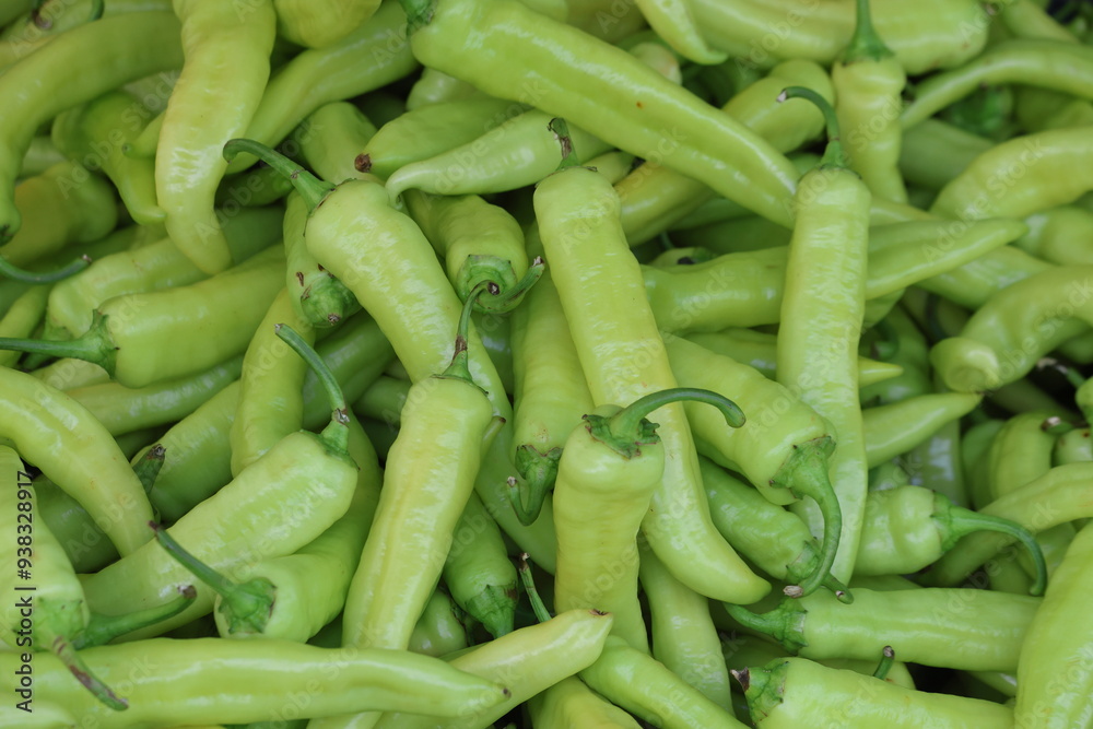 close up of green peppers on market close up of green peppers on market