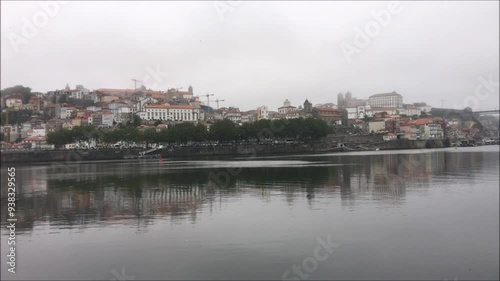Panoramic view of downtown Porto in Portugal, riverside area with morning fog, douro river valley