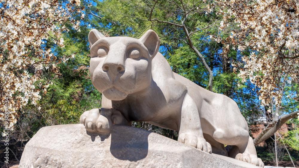 The Nittany Lion with spring flowers in the campus of Penn State University, University Park, Pennsylvania.