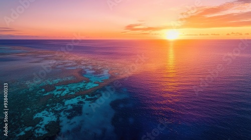 Serene ocean sunrise showcasing vibrant colors over tranquil waters and coral reefs. Perfect for nature lovers and travel enthusiasts.