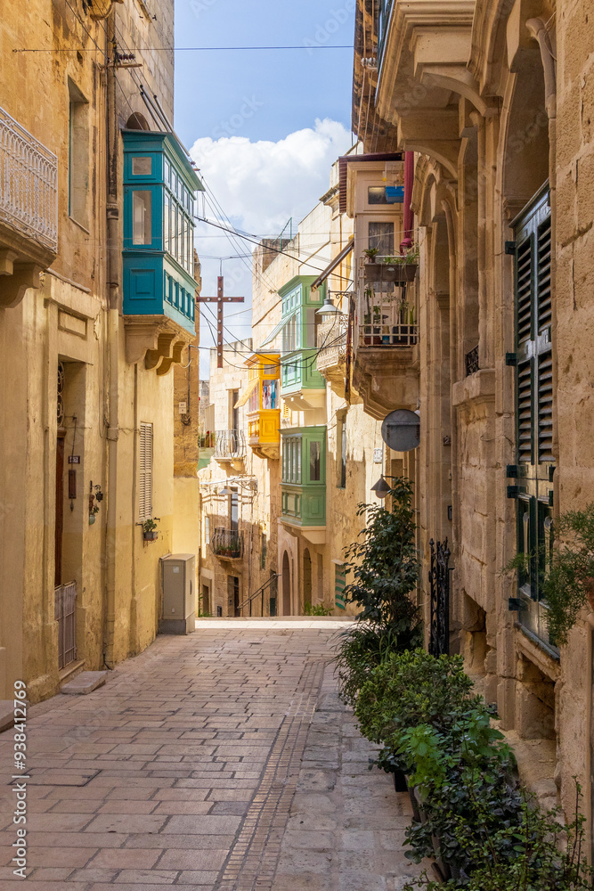 Malta, Birgu. Narrow street with stone buildings. Malta, Birgu. Narrow street with stone buildings.