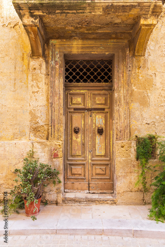 Malta, Birgu. Double door in stone building.