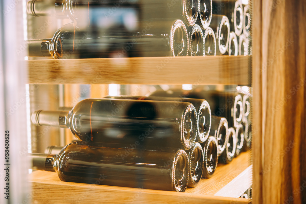 Different bottles of wine storing in a bar or restaurant.