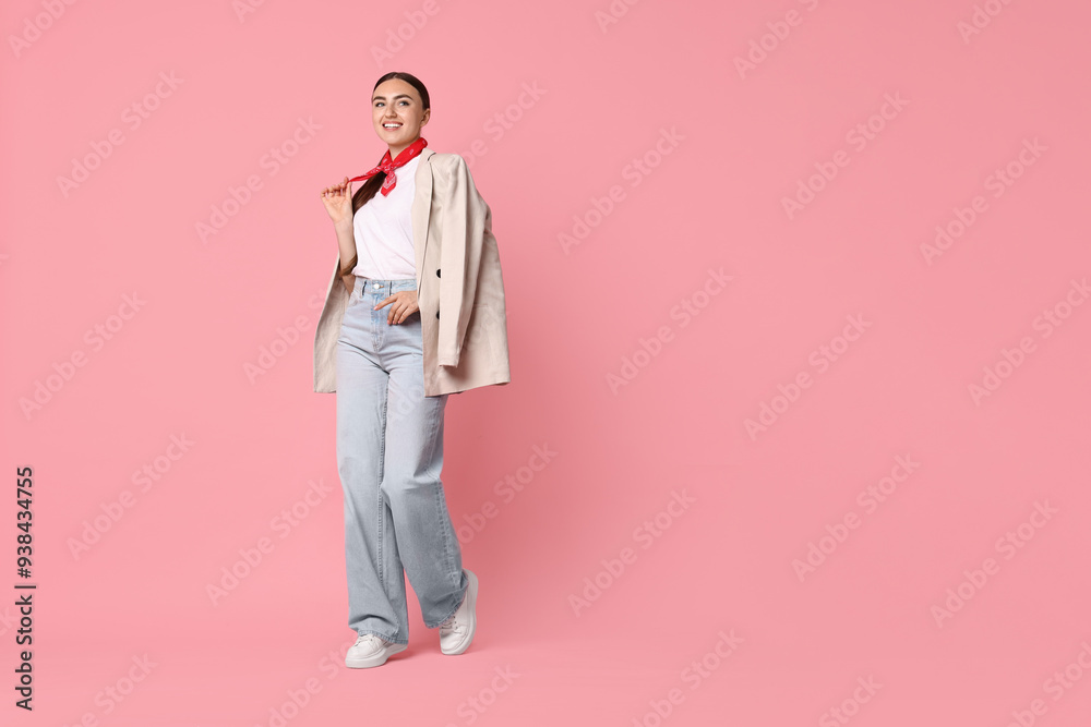Stylish woman in beige jacket and jeans on pink background, space for text Stylish woman in beige jacket and jeans on pink background, space for text