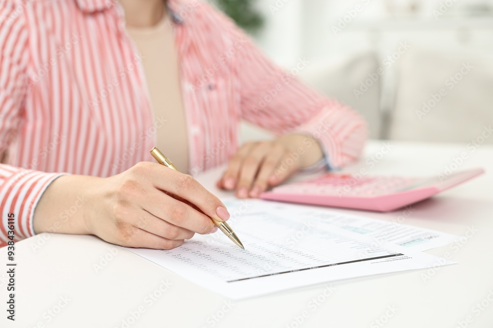 Budget planning. Woman with papers at white table, closeup Budget planning. Woman with papers at white table, closeup