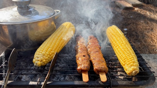 Grilled sweetcorns with shish kebab fried on wooden sticks. Made from minced meat. Lula kebab, a specialty of Turkish Azerbaijani and Armenian cuisines. Lüle, Lyulya, Adana or Urfa kebap. BBQ Close Up photo