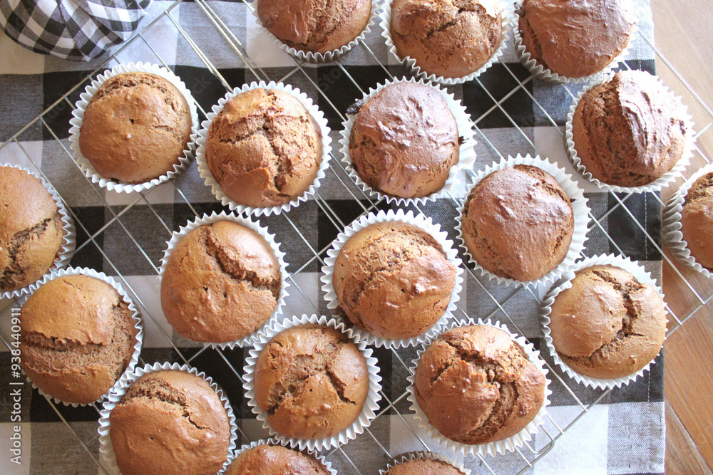 Fresh Baked Homemade Gingerbread Muffins with Buffalo Check and Sunflower Background Fresh Baked Homemade Gingerbread Muffins with Buffalo Check and Sunflower Background