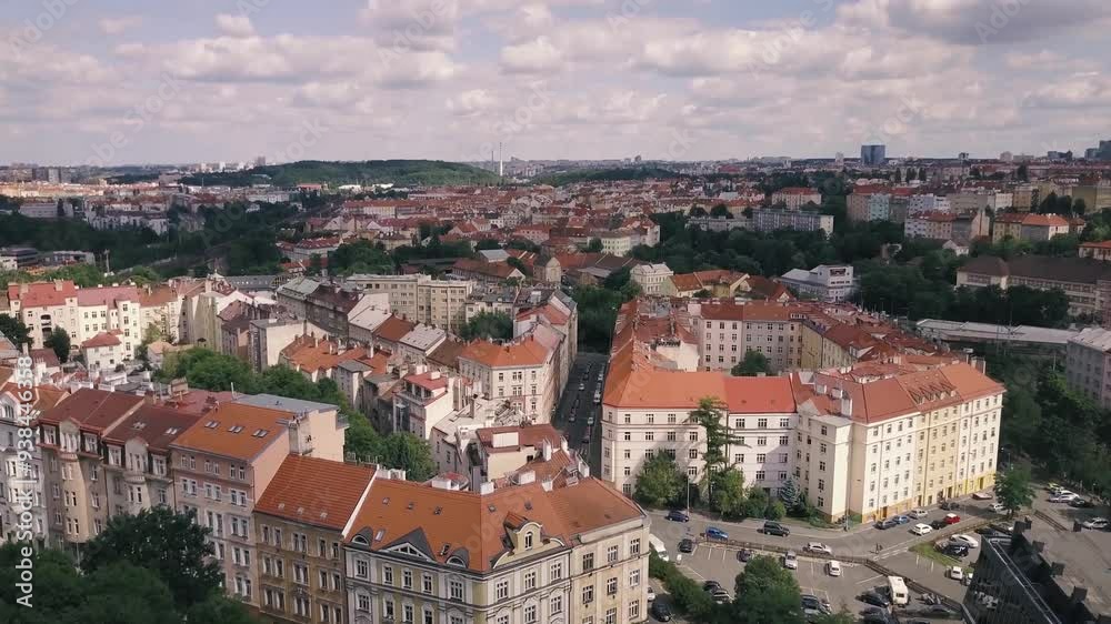 Aerial video of Prague historical center on sunny day with rooftops, buildings, bridges, cathedrals, and roads. Aerial video of Prague historical center on sunny day with rooftops, buildings, bridges, cathedrals, and roads.