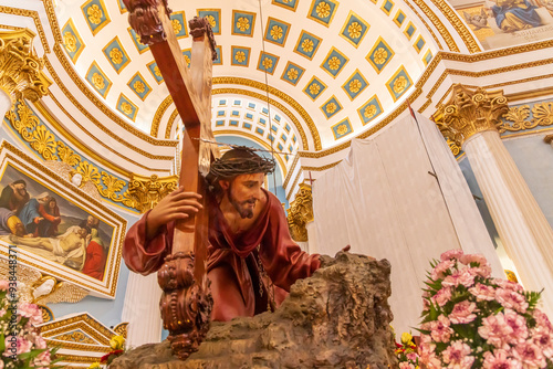 23 Mar 2023. Malta, Mosta. Sanctuary Basilica of the Assumption of Our Lady, commonly known as the Rotunda of Mosta or the Mosta Dome. Interior. Statue of Jesus carrying the cross. photo