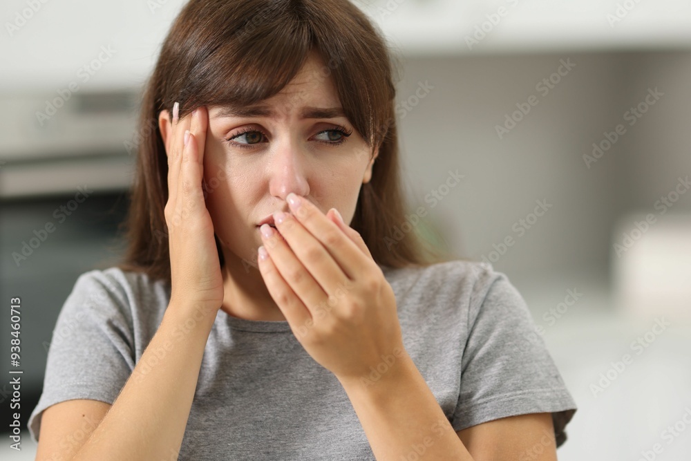 Tired woman suffering from sinusitis at home Tired woman suffering from sinusitis at home