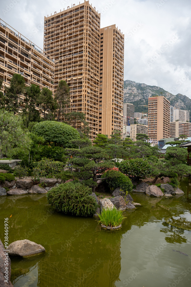 Landscape urban design, city park in Japan style with stones, bonsai pines trees, flowers, little briges, water falls in center of Monte-Carlo city, Monaco Landscape urban design, city park in Japan style with stones, bonsai pines trees, flowers, little briges, water falls in center of Monte-Carlo city, Monaco