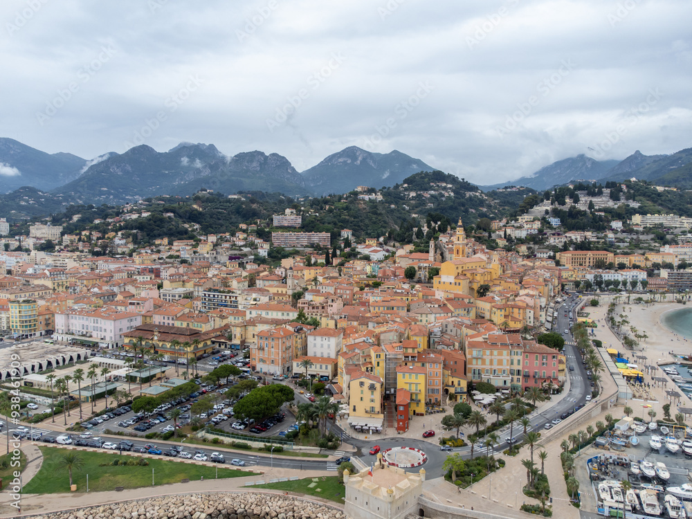 Fototapeta premium Aerial view on French Riviera, colorful Menton old city and marina on Mediterranean Sea near French-Italian border, travel destination, panoramic view from above