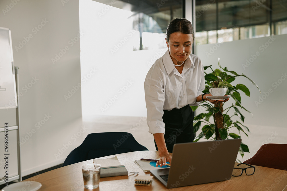 A Professional Woman Engaged in Work Activities Within a Contemporary Office Environment A Professional Woman Engaged in Work Activities Within a Contemporary Office Environment