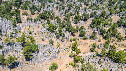 The area of conglomerates of rocks surrounding the ancient city of Selge in Antalya. The area called Avatar Land, named Rocks of Man, because it resembles a standing person, creates a fantastic image. photo