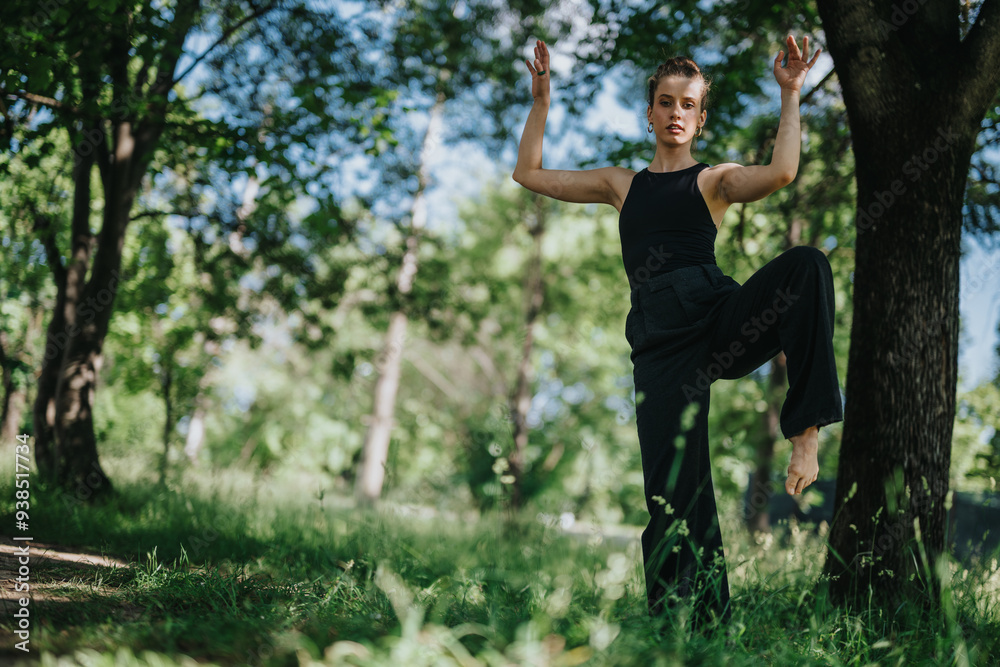 Lovely girl dancing in nature, executing elegant modern dance moves surrounded by a lush green forest. Lovely girl dancing in nature, executing elegant modern dance moves surrounded by a lush green forest.