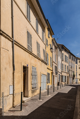 typical old facade in Aix en provence with ochre painted facades