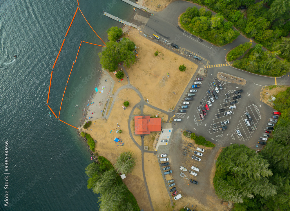 Naklejka premium A view of a beach with a red and white barrier and a red and white tent