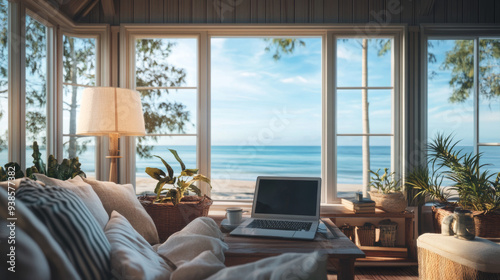 working remotely from a cozy beach cottage, with a laptop, coffee, and ocean view