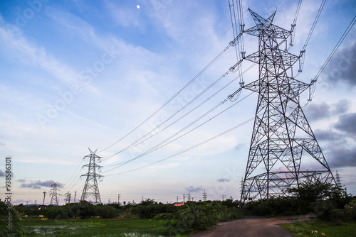 power lines and towers in the field near chennai city in south India 