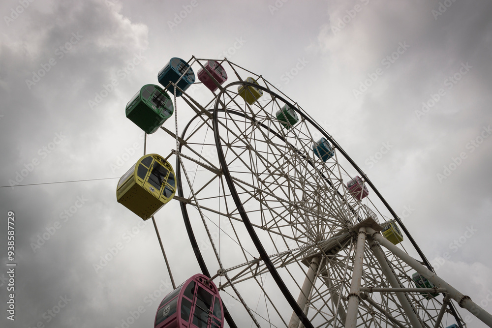 ferris wheel on a cloudy sky ferris wheel on a cloudy sky