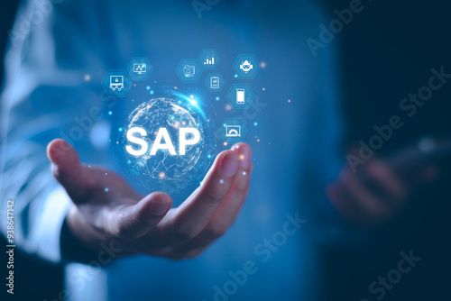 SAP System Application Products. Business process automation and management software concept. Businessman presents SAP related technology icons, business process automation, and management solutions. photo