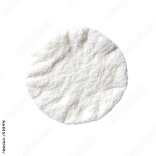 A close-up image of a soft, round cotton pad, perfect for makeup application or skincare routines. Its texture and shape highlight functionality and versatility in personal care.