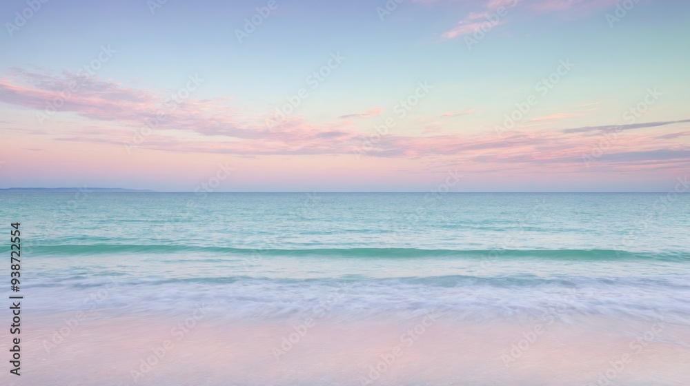 Serene ocean waves gently lapping against a tranquil beach under a pastel-hued sunset sky. Calming seascape with soft, pink and blue colors, perfect for relaxation and peaceful nature themes.

