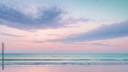 Serene ocean waves gently lapping against a tranquil beach under a pastel-hued sunset sky. Calming seascape with soft, pink and blue colors, perfect for relaxation and peaceful nature themes.

