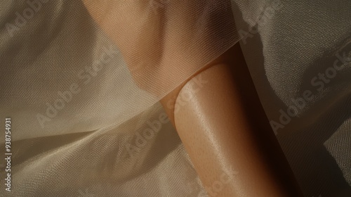 A closeup shot of a womans leg with natural unshaven hair gracefully resting on a soft fabric The lighting is warm and soft emphasizing the texture of the hair and the smoothness of the skin presentin