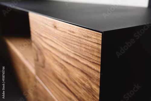 Bild auf Leinwand Closeup details of modern tv stand made from walnut and powder coated steed