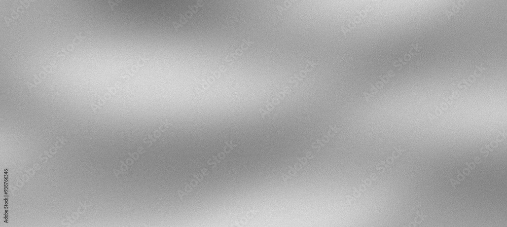 Silver gradient created by light reflecting on a textured, grainy surface Silver gradient created by light reflecting on a textured, grainy surface