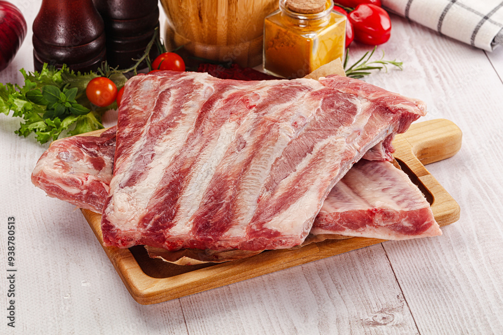 Raw pork ribs over board Raw pork ribs over board