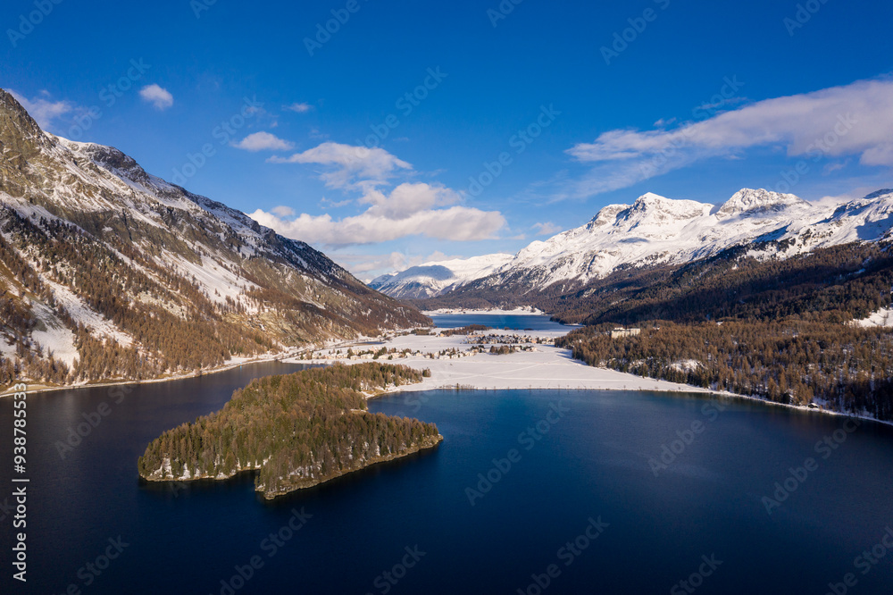 Lake Sils, Switzerland: Dramatic aerial view of lake Sils, lake Silvaplana and the Corvatsch peak near St Moritz in the Swiss alps in winter