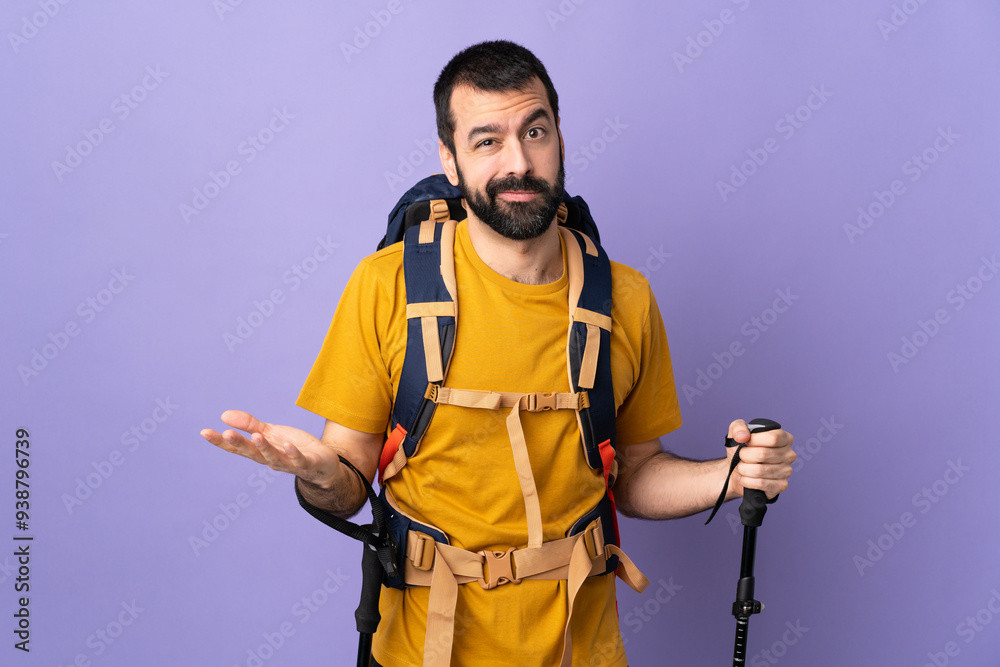 Caucasian handsome man with backpack and trekking poles over isolated background having doubts Caucasian handsome man with backpack and trekking poles over isolated background having doubts