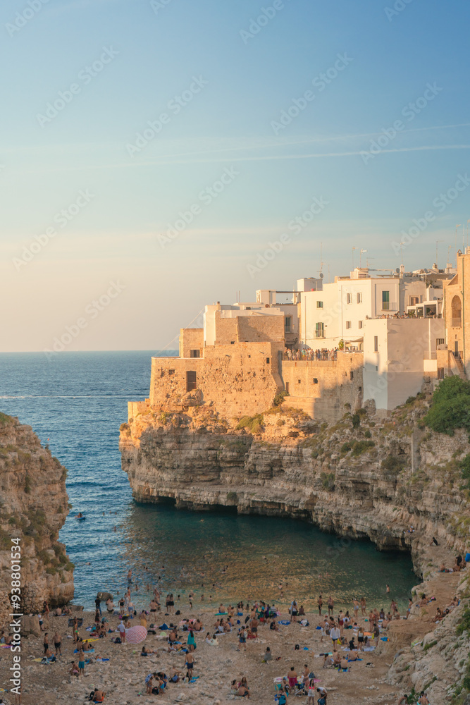 Lama Monachile Bay at sunset view in Polignano a Mare in Puglia. Lama Monachile Bay at sunset view in Polignano a Mare in Puglia.