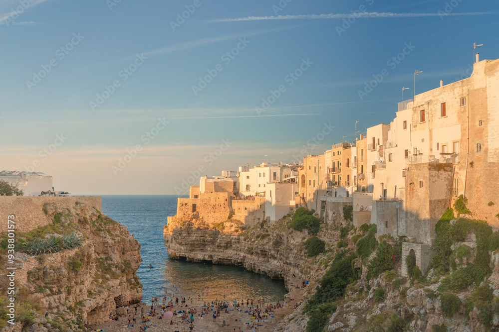 Lama Monachile Bay at sunset view in Polignano a Mare in Puglia. Lama Monachile Bay at sunset view in Polignano a Mare in Puglia.