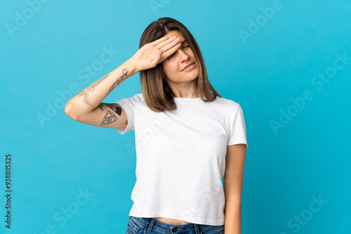 Young slovak woman isolated on blue background with tired and sick expression