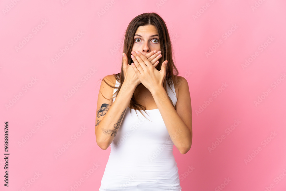 Young slovak woman isolated on pink background covering mouth with hands Young slovak woman isolated on pink background covering mouth with hands
