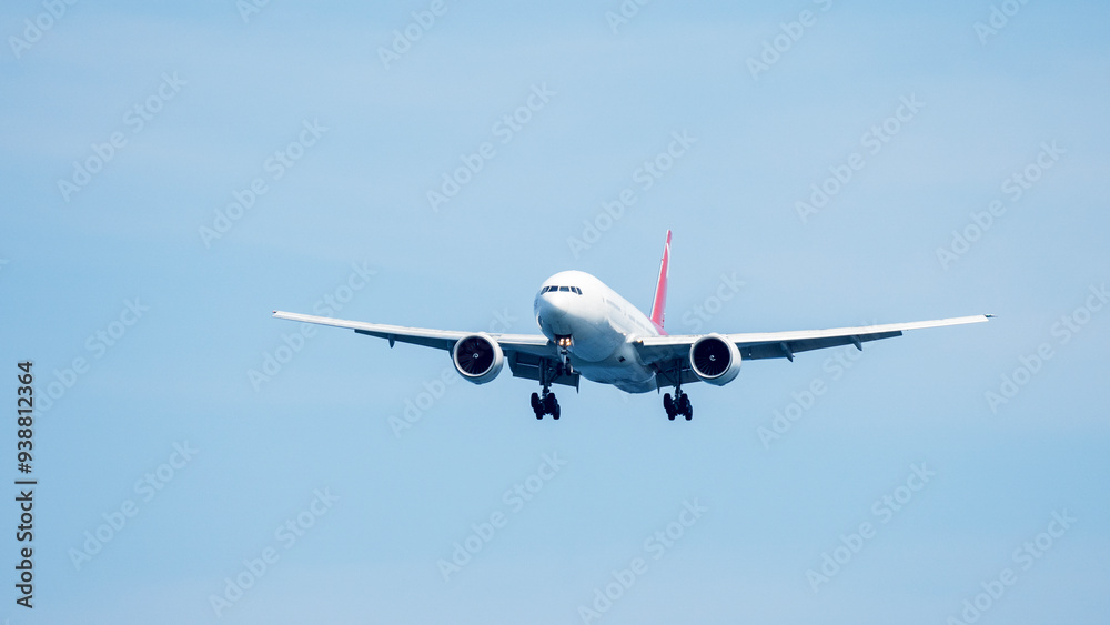 A passenger plane or airliner comes in to land at the airport A passenger plane or airliner comes in to land at the airport