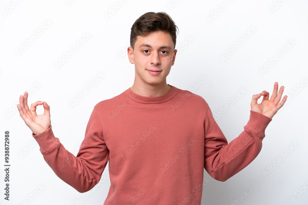 Young handsome Brazilian man isolated on white background in zen pose Young handsome Brazilian man isolated on white background in zen pose