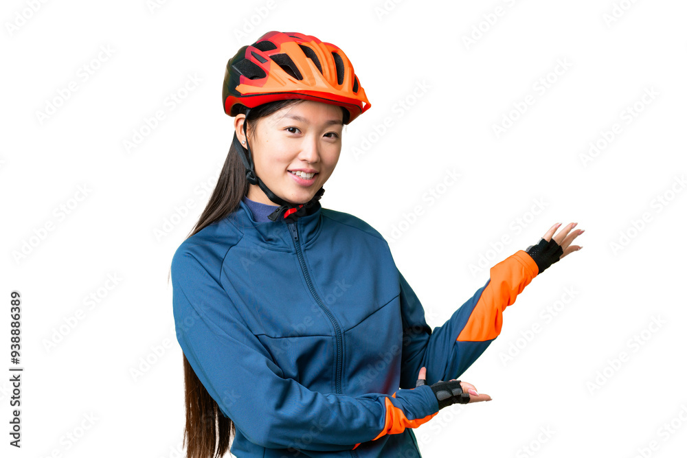 Young cyclist woman over isolated chroma key background extending hands to the side for inviting to come Young cyclist woman over isolated chroma key background extending hands to the side for inviting to come