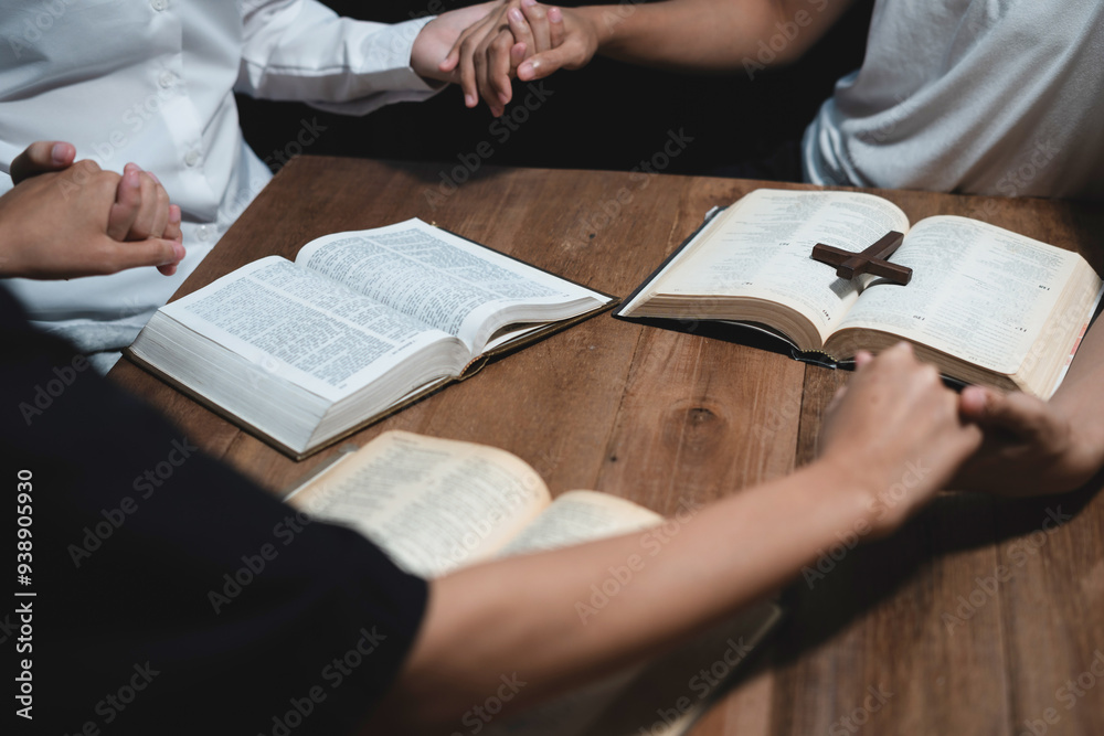 Obraz premium Asian men and women hands praying to god with the bible. Pray for god blessing. Religious beliefs Christian life crisis prayer to god.