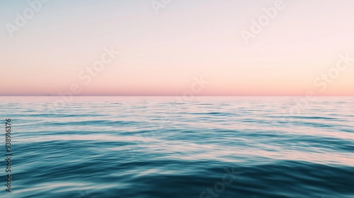 Tranquil ocean at sunset with pastel-colored sky